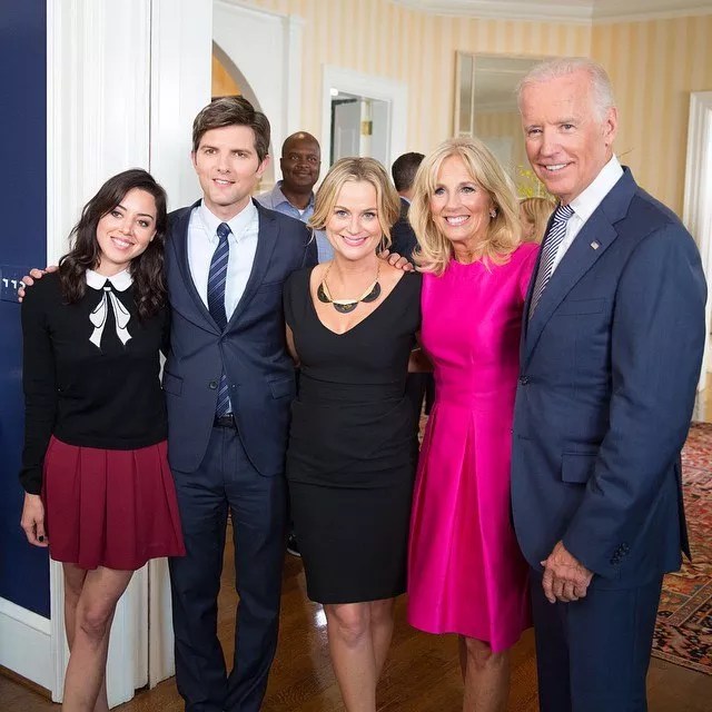 The Parks and Rec cast (from left: Aubrey Plaza, Adam Scott and Amy Pohler)  with First Lady Jill Biden and President Joe Biden (fourth and fifth from left).